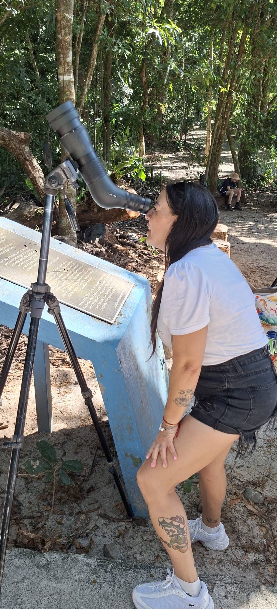 Guest birdwatching with a spotting scope in Costa Rica