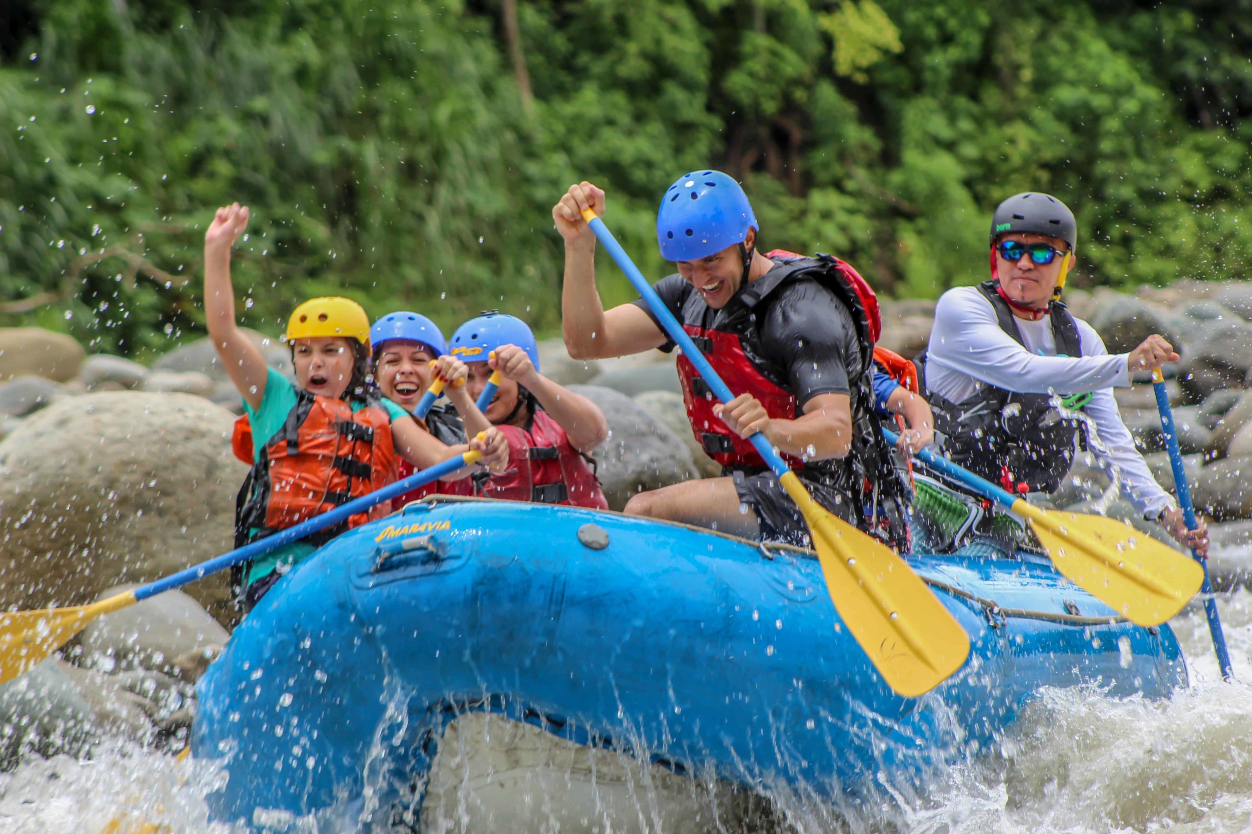 Guests riding white water rapids in Costa Rica