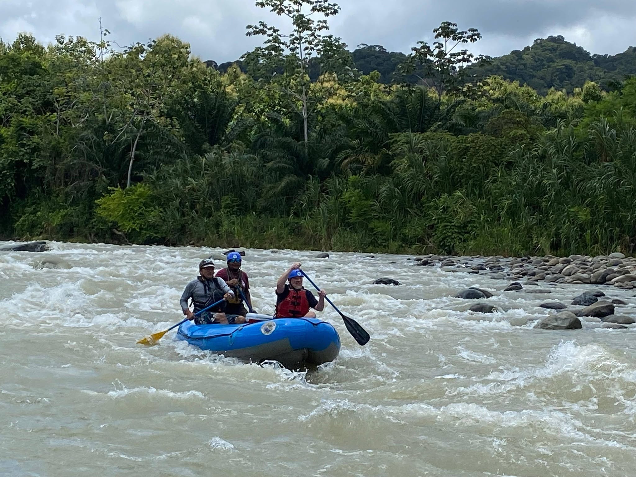 Naturaleza Pura Vida rafting guide with guests in Costa Rica